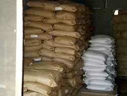 Sacks of oatmeal and rice arrive in the container