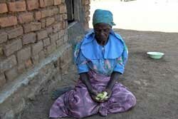 Malawi Woman Eating Mangos