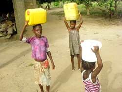 Children carry pails of food 
