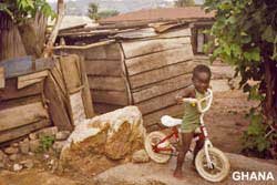 Child with undreamed of luxury - a bike