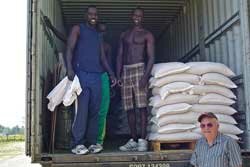 Local Sudanese helping load shipment of peas