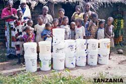 Residents of Ponya with pails of food
